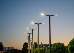 A modern street LED lighting pole. Urban electro-energy technologies. A row of street lights against the night sky.